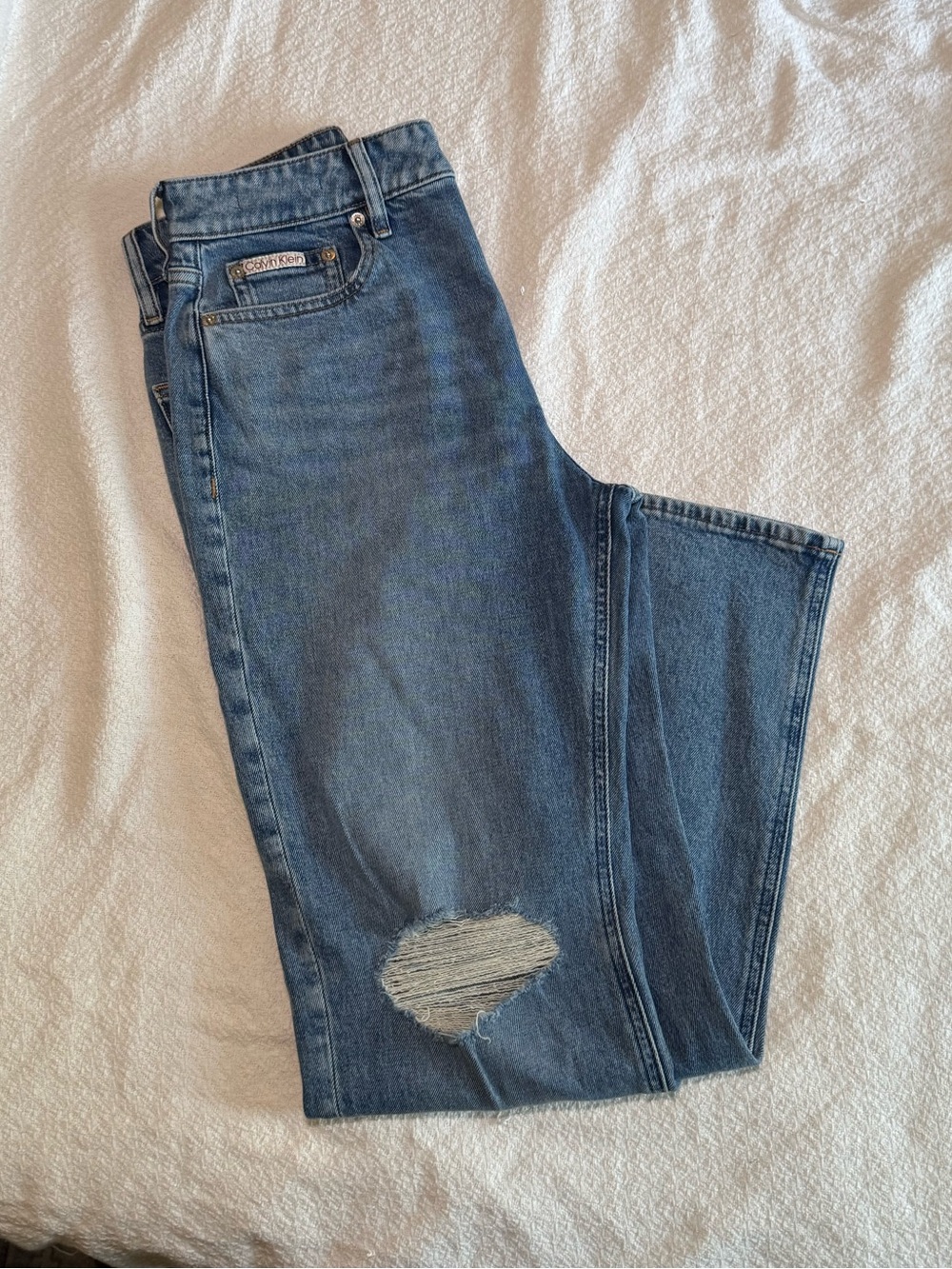 Calvin Klein high rise straight light blue denim distressed jeans